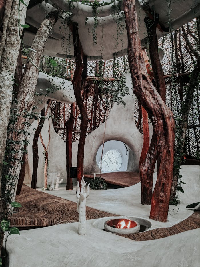 An artistic indoor space featuring natural wood beams and minimalist design elements.